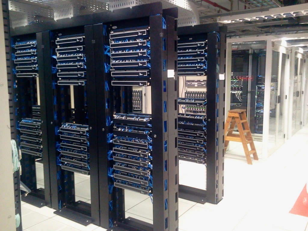 Rows of server racks in a data center, representing the protected backend